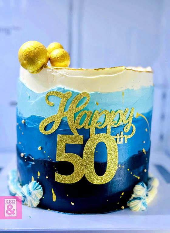 Blue and gold fiftieth birthday cake