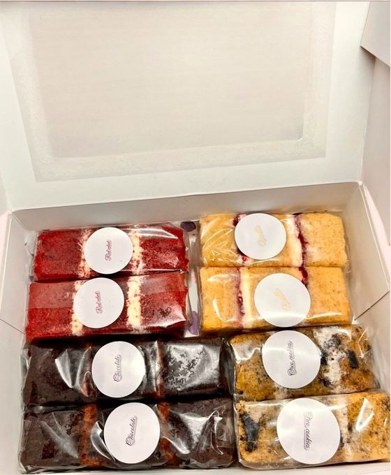 A cake tasting box with individually wrapped labelled slices